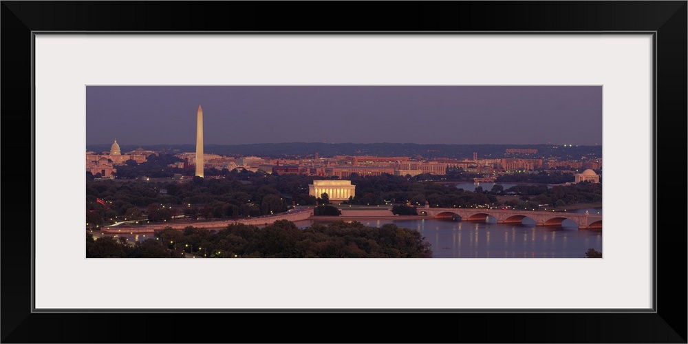 Wide angle, aerial photograph of Washington DC at night, including the Washington Monument, the Capitol Building and the L...