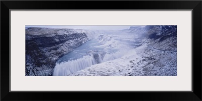 Water flowing through snow covered mountains, Gullfoss Falls, Vesturland, Iceland