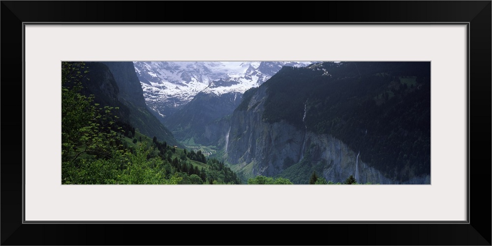 Waterfalls in a forest Lauterbrunnen Valley Wengen Bernese Oberland Berne Canton Switzerland