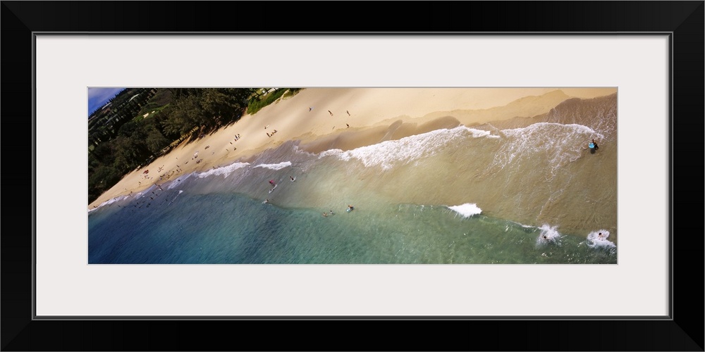 Long photo on canvas of ocean waves crashing on the shore of a Hawaiian beach.