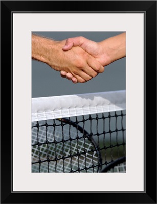 Tennis players' handshake over the net