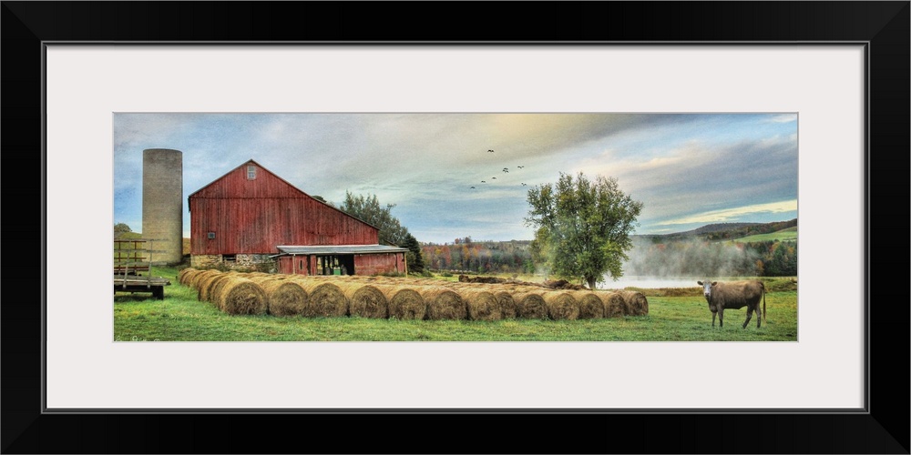 Photograph of a red barn in rural countryside scene.