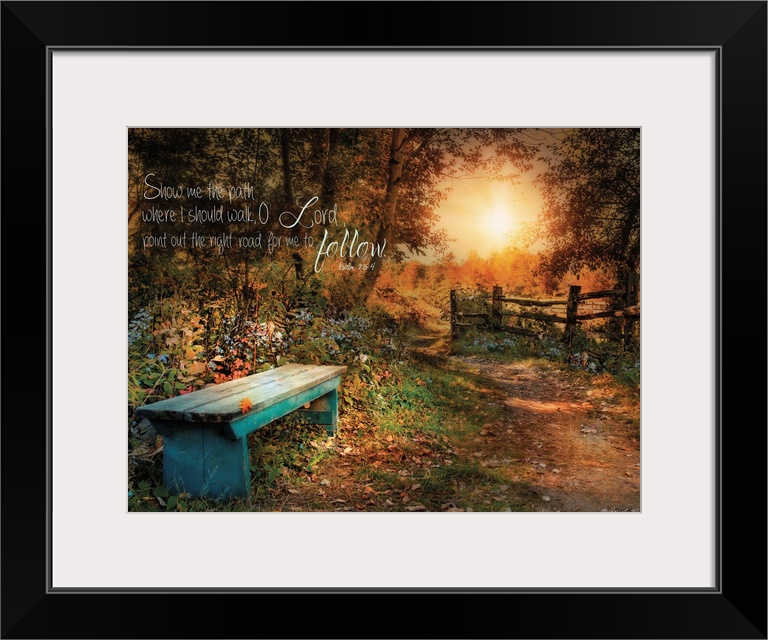A small bench in the woods near a fence at sunset, with a bible verse.
