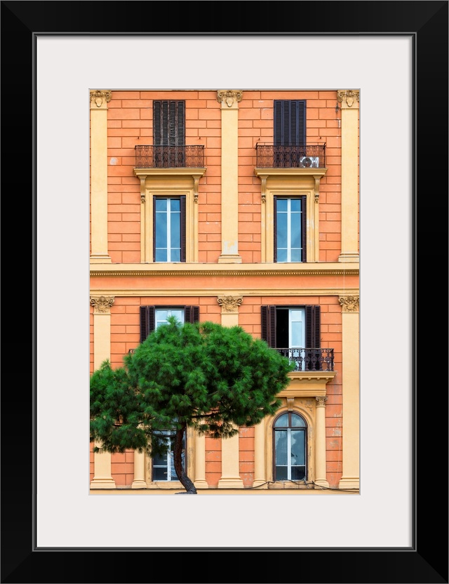 It's a orange facade of a building in the city of Rome in Italy.