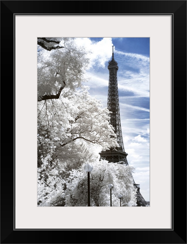 A view of the Eiffel Tower in Paris, made in infrared mode in summer. The vegetation is white and rendering of the sky is ...