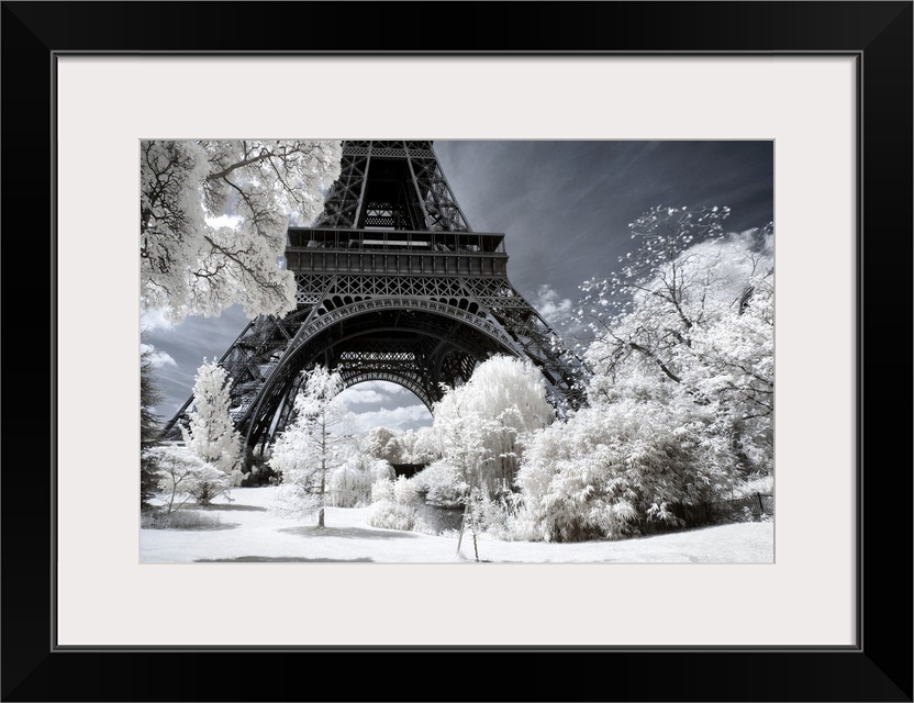 A view of the Eiffel Tower in Paris, made in infrared mode in summer. The vegetation is white and rendering of the sky is ...