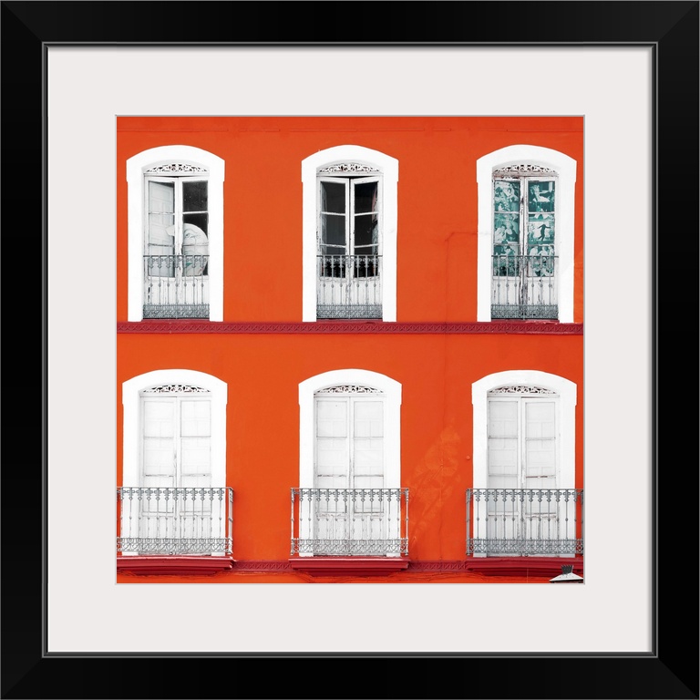 It's a beautiful orange facade of an old building in Seville, Spain.