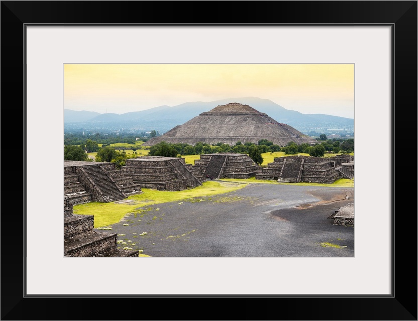 Photograph of the ancient pyramids in Teotihuacan, Mexico, featuring the Pyramid of the Sun and a warm sky. From the Viva ...
