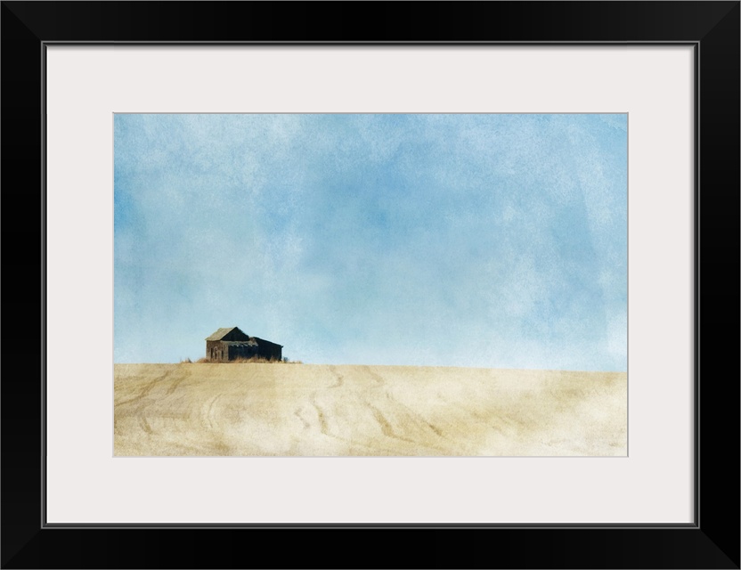 A painterly photo of a small abandoned farmhouse in the middle of a prairie grain field.