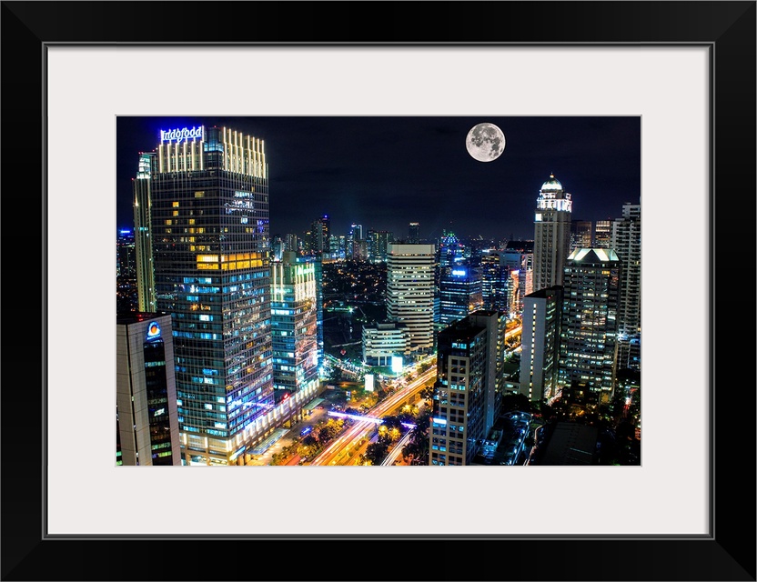 Moon over the city of Jakarta, Indonesia, at night.