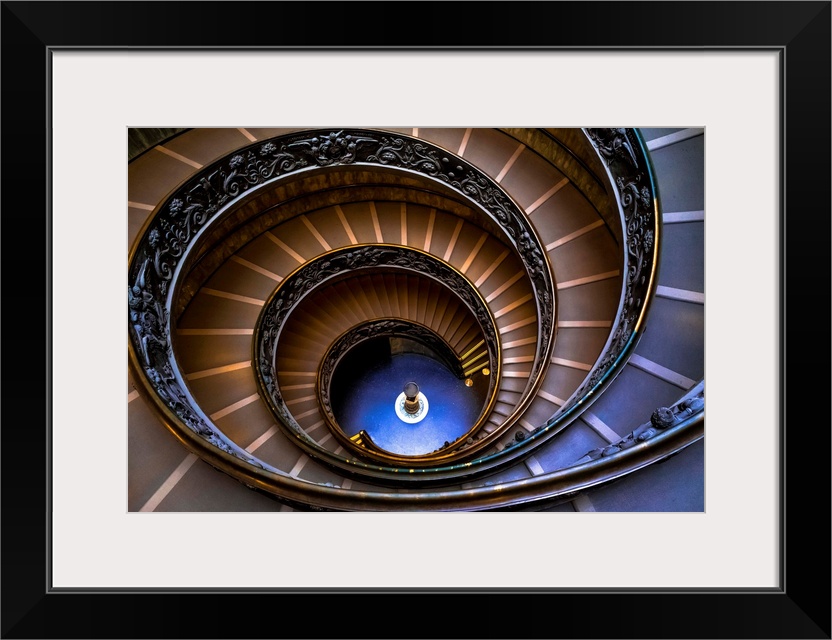 Looking down a spiral staircase in the Vatican Museum.