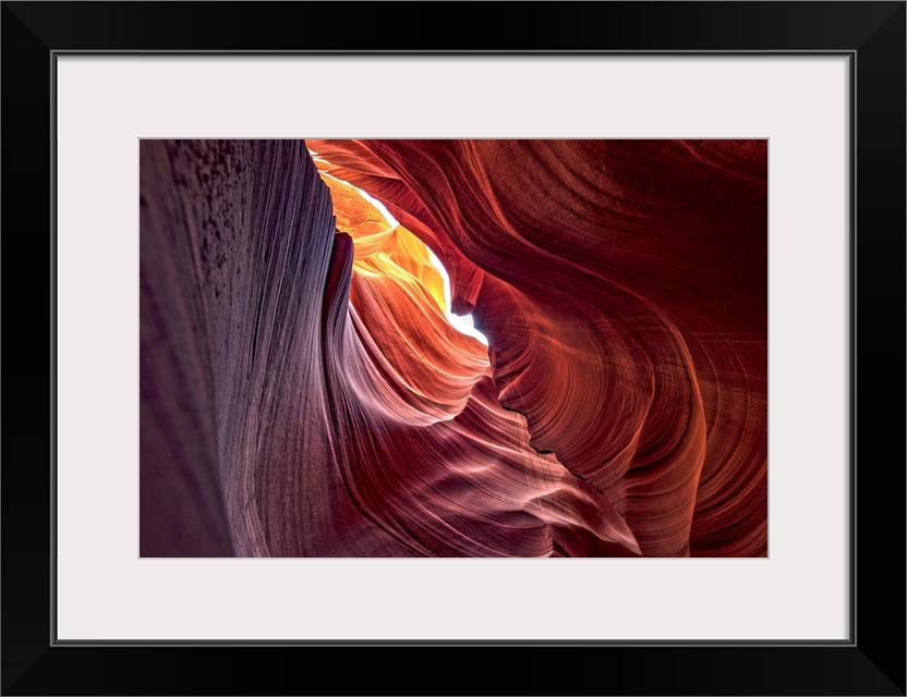 Photograph from inside of Antelope Canyon rock formation located on the Navajo Reservation in Page, Arizona with colorful ...