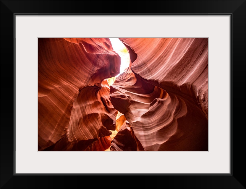 Photograph from inside of Antelope Canyon's rock formation located on the Navajo Reservation in Page,  Arizona with flowin...