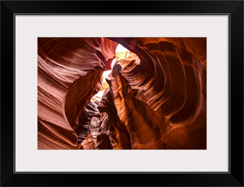 Photograph from inside of Antelope Canyon rock formation located on the Navajo Reservation in Page, Arizona with flowing p...