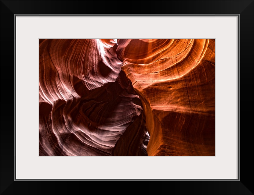Photograph from inside of Antelope Canyon rock formation located on the Navajo Reservation in Page, Arizona with contrasti...