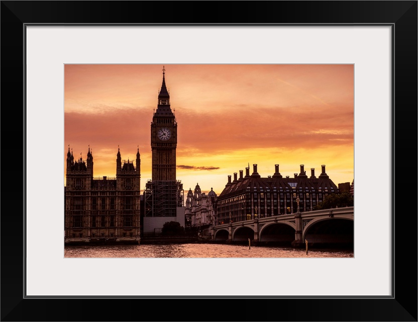 View of Big Ben and Westminster Bridge at sunset in London, England.