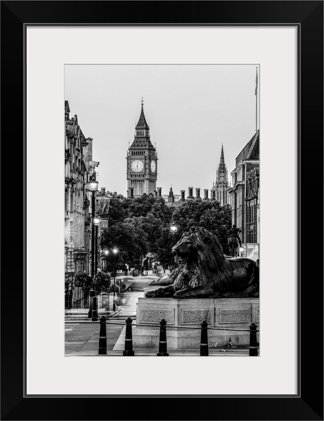 Black and white photograph of Trafalgar Square with the iconic Trafalgar Lions in the foreground and Big Ben in the backgr...