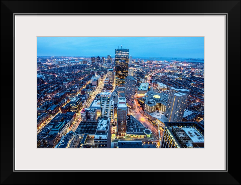 Photo of Boston cityscape at night featuring the John Hancock Tower.