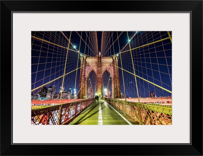 One of the stone piers surrounded by many cables on the Brooklyn Bridge in New York.