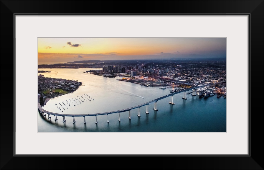 Aerial view of the Coronado Bridge in San Diego, California, at sunset.