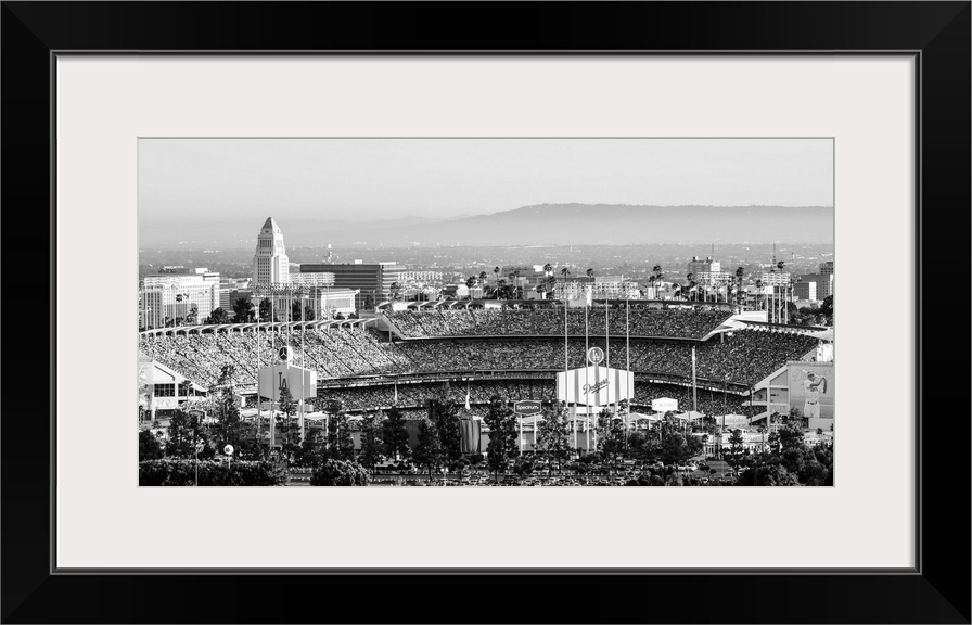 Panoramic photograph of Dodger Stadium lit up on a game night.