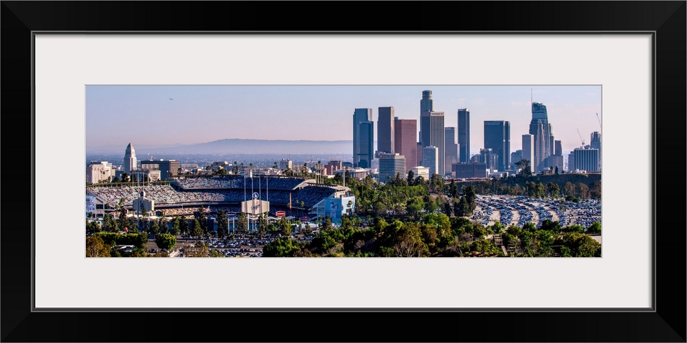 Panoramic photograph of the downtown Los Angeles skyline with Dodger Stadium on the left.