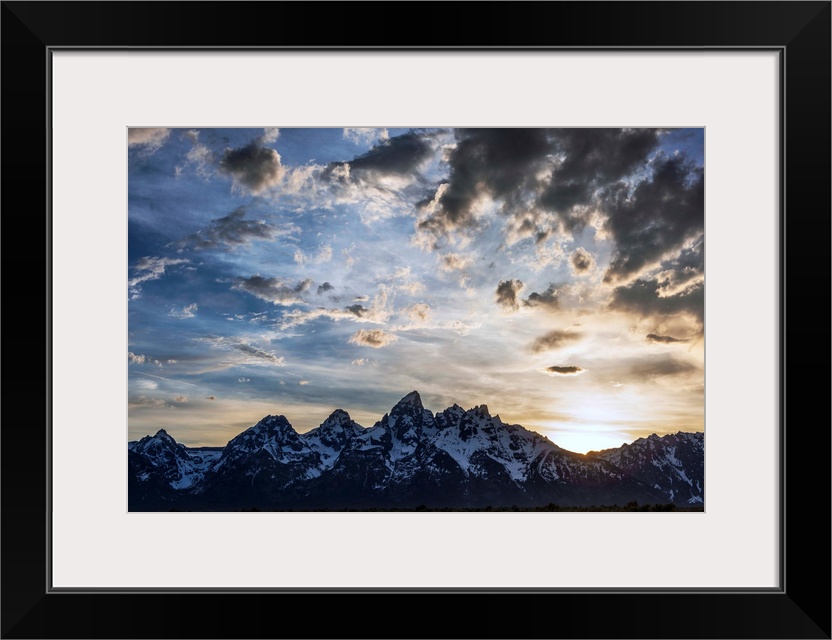 View of dramatic clouds over Teton mountains in Wyoming.