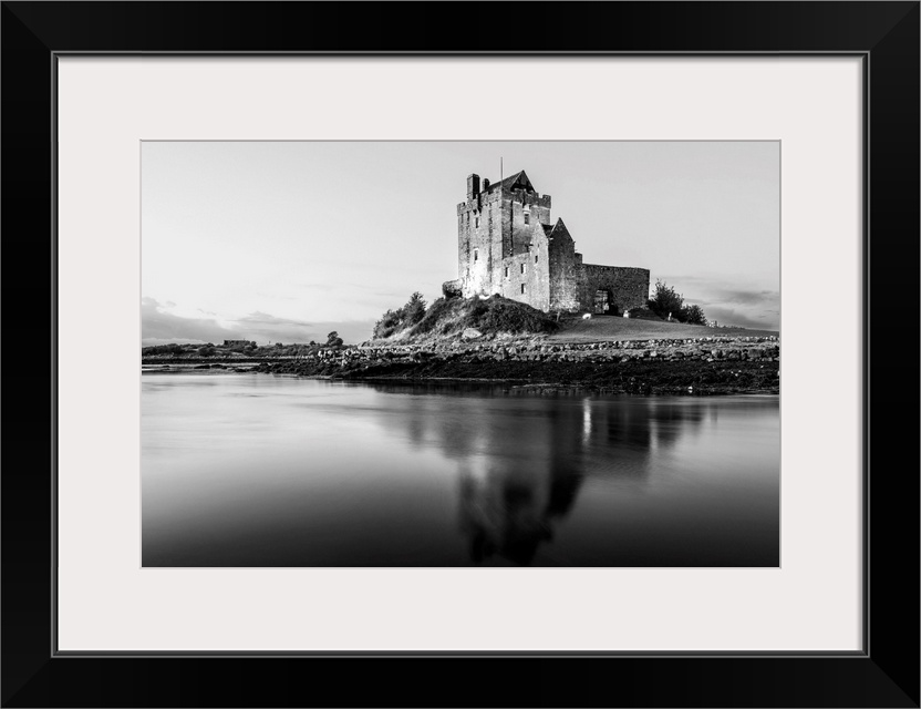Black and White landscape photograph of the Dunguaire Castle reflecting into the water on the southeastern shore of Galway...