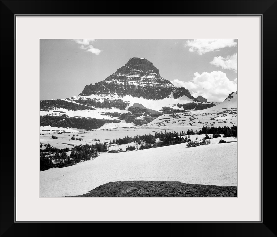 From Logan Pass, Glacier National Park, looking across barren land to mountains.