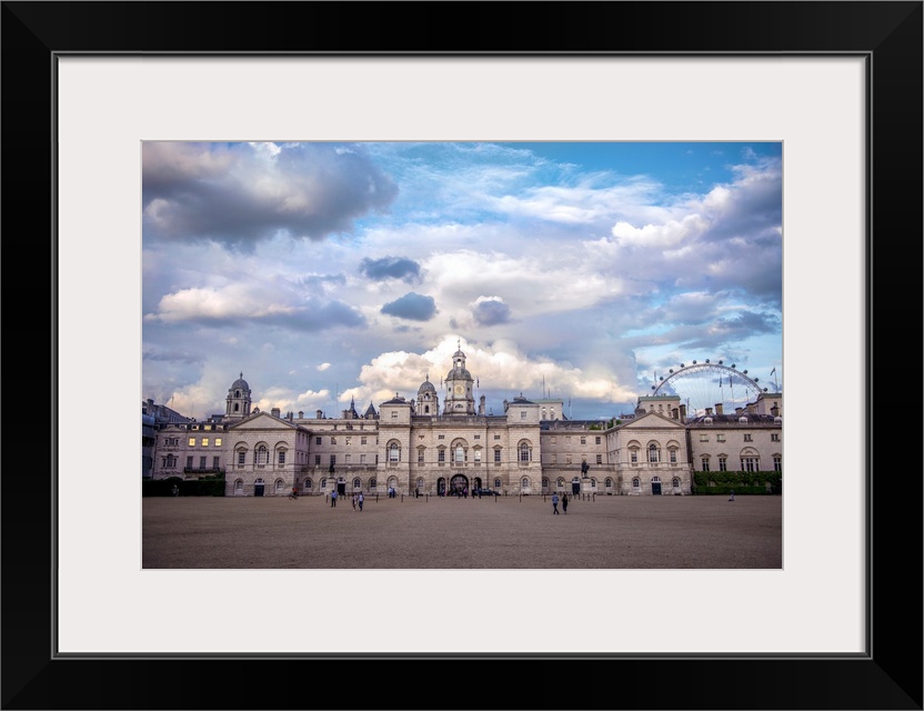 View of Horse Guards building in London, England against a bright blue sky.