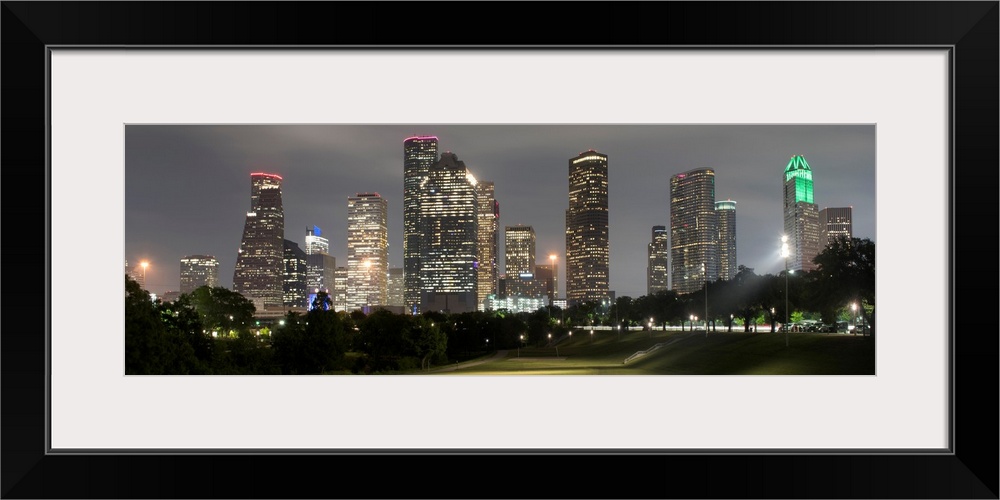 Panoramic photograph of the Houston TX skyline at night from Eleanor Tinsley Park.