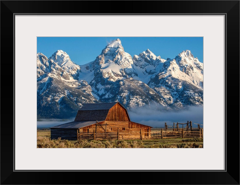 View of the John Moulton Barn with Middle Teton, Grand Teton and Mount Owen in the background. Grand Teton National Park, ...