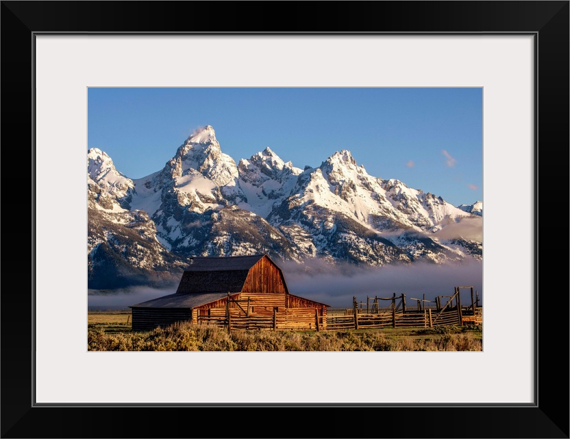 View of the John Moulton Barn with Middle Teton, Grand Teton and Mount Owen in the background. Grand Teton National Park, ...