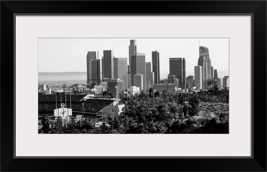 Photograph of the downtown Los Angeles skyline with Dodger Stadium on the left.