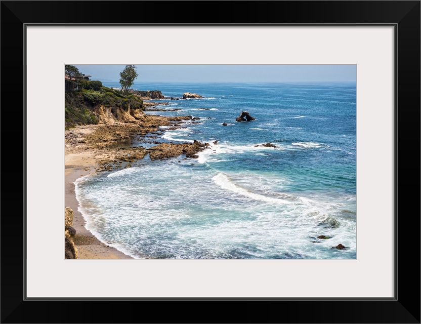 Little Corona del Mar beach is relatively small, flanked on both sides with rocky reefs.