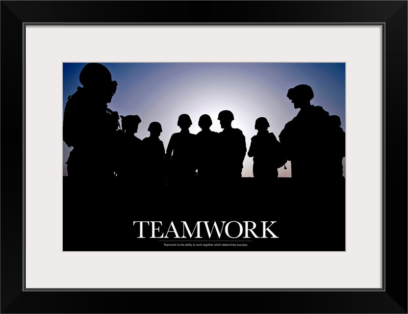 Giant photograph includes a silhouetted group of soldiers that has an inspirational message for teamwork at the bottom.
