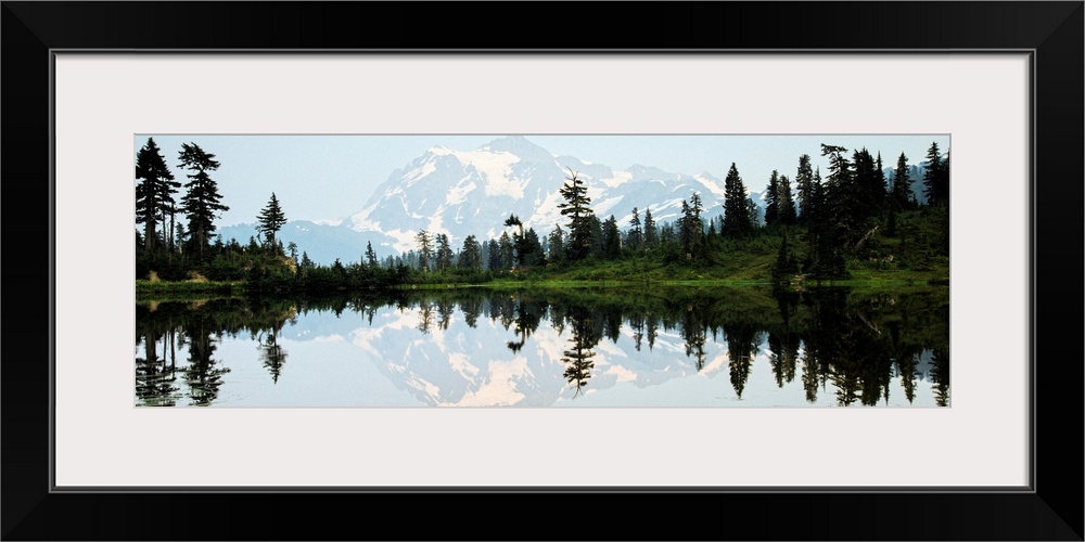 Panoramic photograph of Mt. Shuksan reflecting into Picture Lake around sunset.