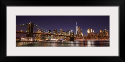 New York City Skyline with Brooklyn Bridge in Foreground, at Night