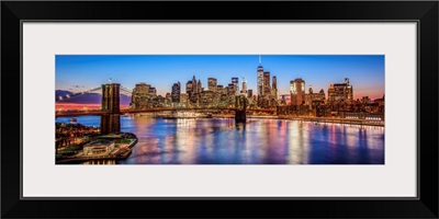 New York City Skyline with Brooklyn Bridge in Foreground, at Night