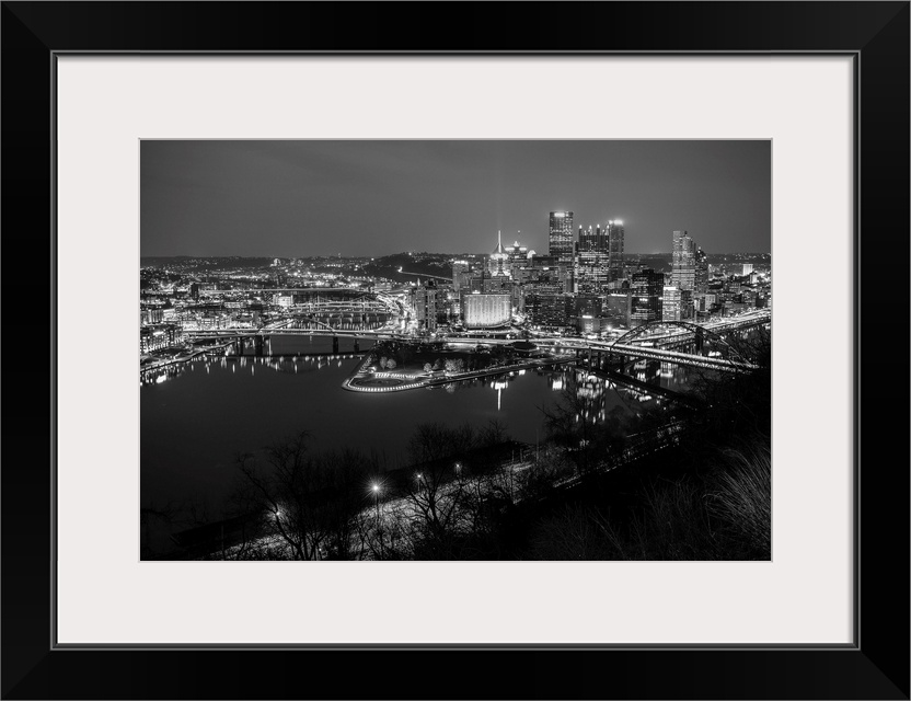 Photo of downtown Pittsburgh at night with Point State park.