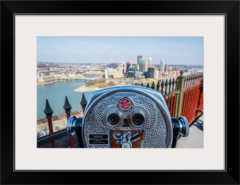 View of downtown Pittsburgh with coin-operated binoculars or tower viewer in the foreground.