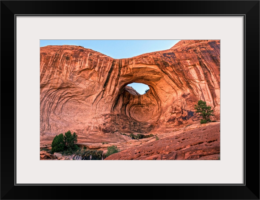 Bright red rock contrasting with the blue sky at the Bowtie Arch, Arches National Park, Utah.