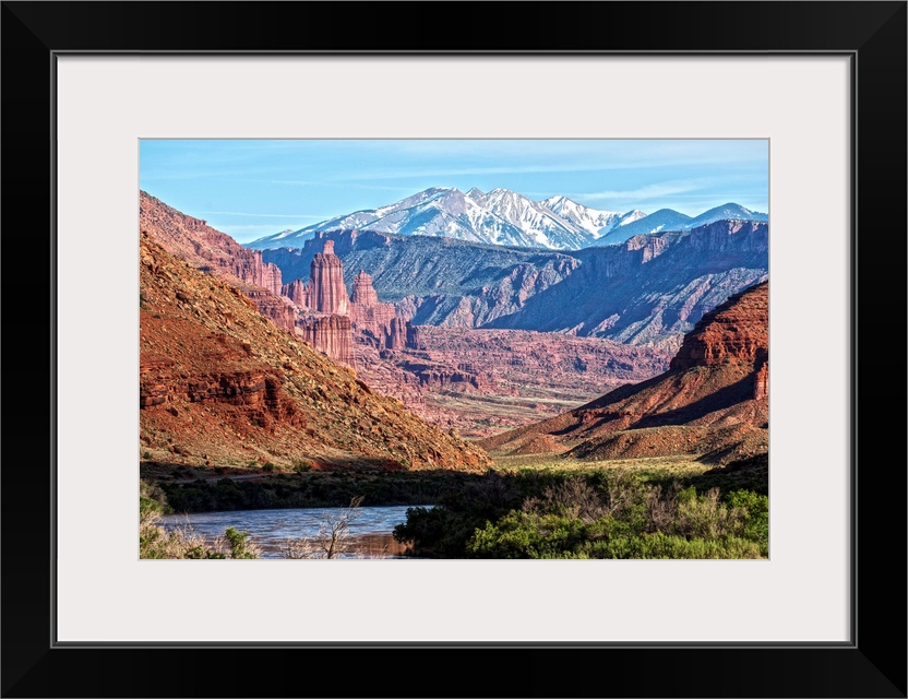 A river running through the Salt Valley of Arches National Park, with a view of the Fiery Furnace and the La Sal Mountains...