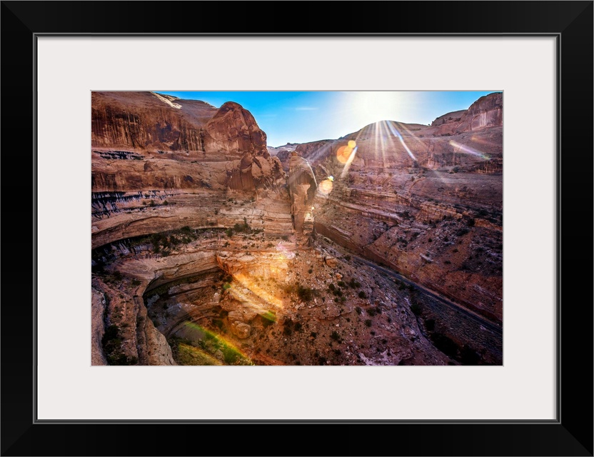 The sun shining on Shafer Canyon, Canyonlands National Park, Utah