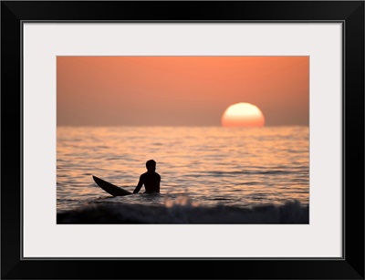 Silhouetted Surfer at Sunset, San Diego Coast, California