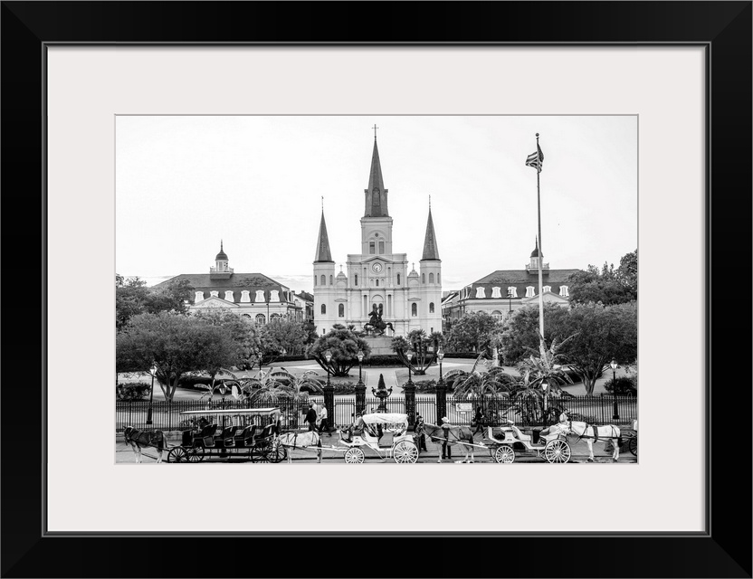 View of carriages stand in front of St. Louis Cathedral and Jackson Square in New Orleans, Louisiana.