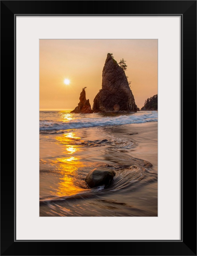 Vertical columns of rock scatter beaches near Olympic National Park, Washington.