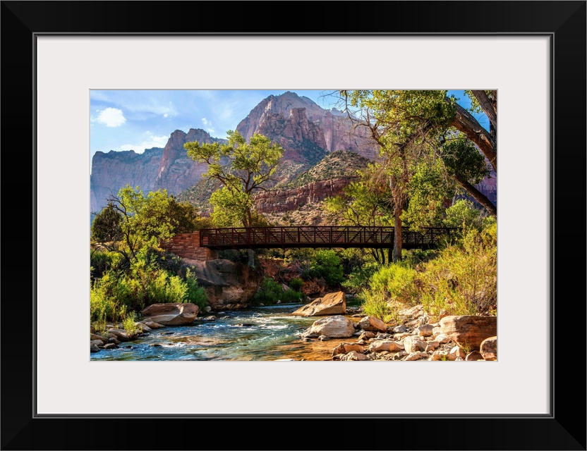 Landscape photograph of a pedestrian bridge over the Virgin River at Zion National Park, UT.