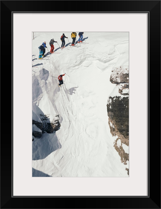 Skilled skiers plunge more than 15 feet in Corbet's Couloir.