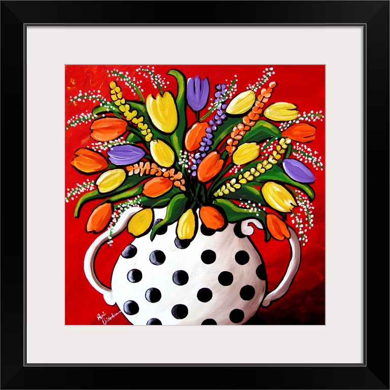 Fun, brightly colored polka dot vase filled with spring flowers and Tulips.